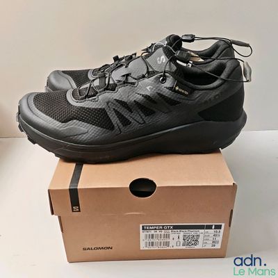 the shoe is sitting on top of a box on a table