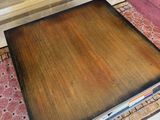 a coffee table that is sitting on a rug in a living room