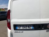 a picture of a white van parked in a parking lot