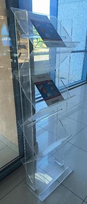 a clear display case with a book on it