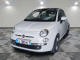 a small white car that is parked in a garage