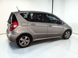 a picture of a silver car parked in a garage