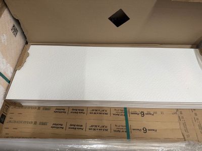 a box with a sheet of paper on top of it
