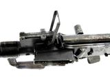 a machine gun that is on display on a white background