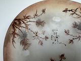 a plate with a painting of birds and flowers on it