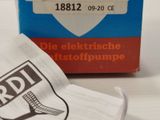 a box of toothbrushes sitting on a table next to a bag of toothpaste