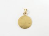a gold plated pendant with a small dog on it