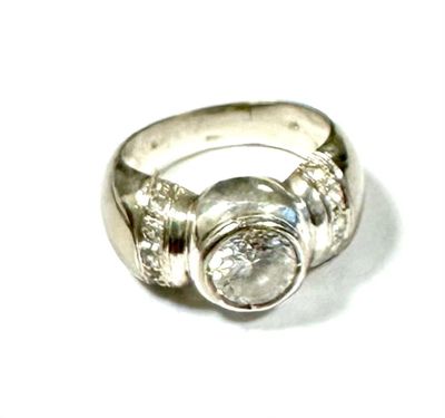 a close up of a ring with a diamond on it