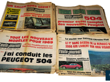 several newspapers are stacked on top of each other on a white surface