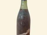 a bottle of wine that has a bird on it