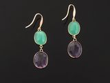 a pair of gold earrings with green and purple stones