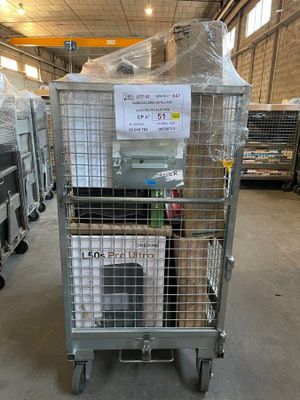 a metal cart with several boxes on it in a warehouse