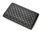 a black leather wallet on a white surface with a white background