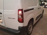 a picture of a white van parked in a garage