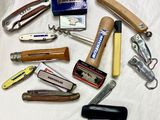 many different types of pocket knives on the table