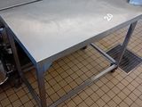 a table with a metal top in a kitchen