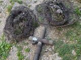 two pipes that are laying on the ground next to each other