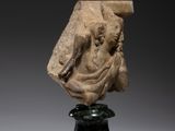a marble head of a woman on a pedestal
