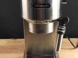 a coffee maker that is sitting on a wooden table