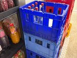 many plastic containers that are stacked on top of each other