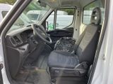 a white van with a black seat and a black bag in the back
