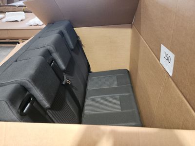 a suitcase in a box that is open on the floor