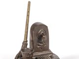 an image of a bronze figurine of a man with a baseball bat