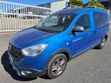 a picture of a blue van parked in a parking lot