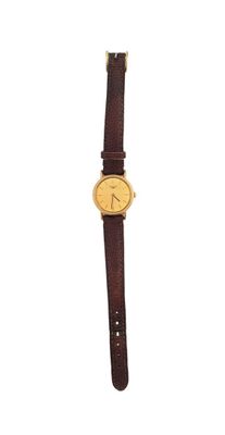 a close up of a watch on a white surface with a white background