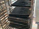 a lot of trays that are sitting on a rack