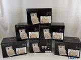 several boxes of black and white items are stacked on top of each other