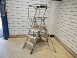 the ladder is leaning against the wall in front of the wall