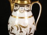 an image of a white and gold coffee pot