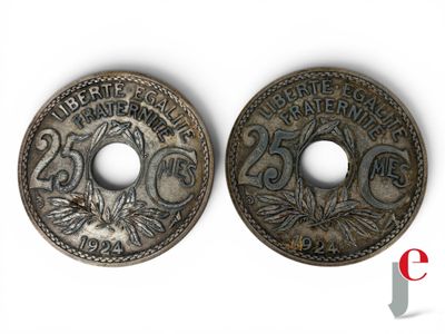 a close up of two coins on a white surface