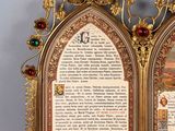 two framed pictures of a cross and a book