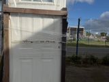 a white door sitting on top of a pallet