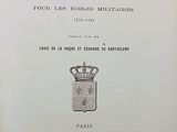 an old book with a crown on top of it sitting on a table