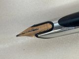 a close up of a pen with a black tip