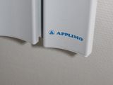 a close up of a white refrigerator with a blue sticker on it