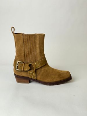 a close up of a pair of brown boots on a white background