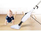 a baby that is playing with a mop on the floor