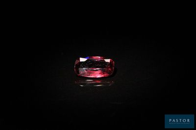 a pink tourmaline gems in the dark
