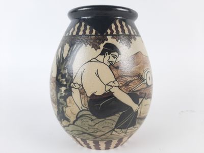 a vase that has a picture of a man on it