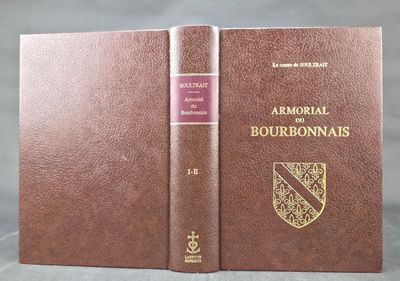 an old book with a brown cover sitting on top of a table