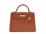 a brown leather handbag on a white background