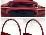 three pictures of a red purse with a zipper on the inside