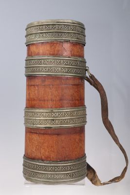 a small wooden box with a strap on it