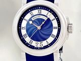 a close up of a wrist watch with a blue strap