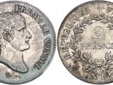 a close up of a coin with a woman ' s face on it