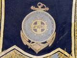 a blue and gold flag with a crown on it